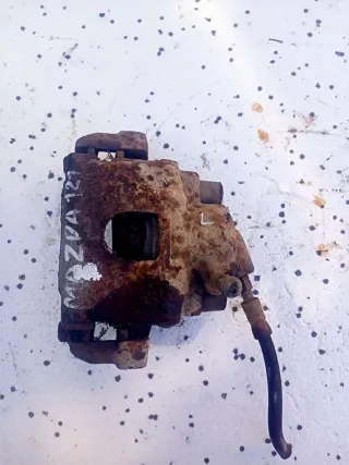  Суппорт тормозной передний левый Mazda 121 3 Арт 76570831, вид 1